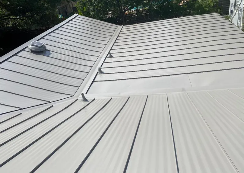 Solar attic fan installed on a metal roof for Roof Ventilation in Marlow Heights
